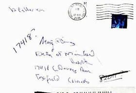 envelope with stamps, address and postage