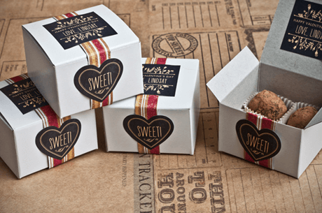 white packaging boxes with red and gold accents for packing cookies