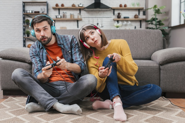 A couple happily playing a video game