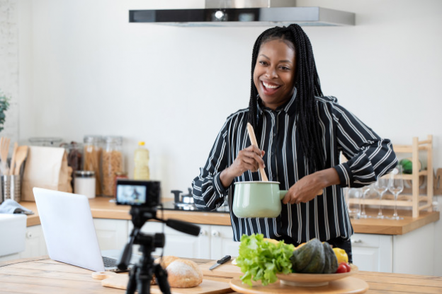 An African-American food maker vlogging on her website