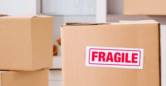 fragile handle with care label on white background labeling products that are fragile with colored paper