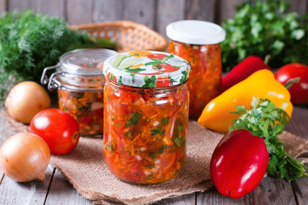 A jar containing a salad with liquid and solid components