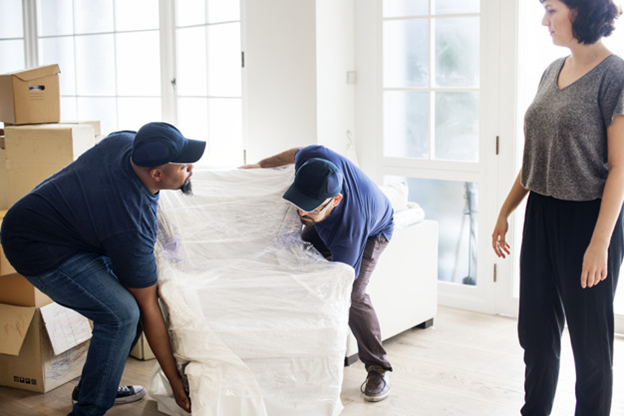 Professional Movers Moving a Chair