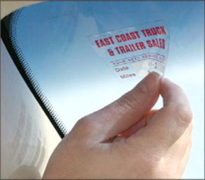 This oil change sticker is an example of a clear BOPP label