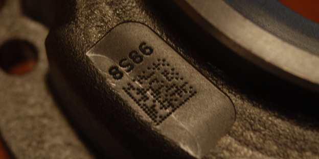 A QR code is laser-printed on leather, which easily wrinkles or folds