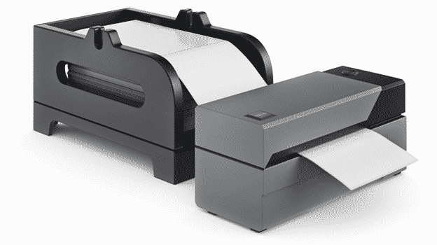 A Rollo label holder is loaded with fanfold labels