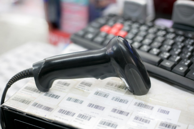 A scanner on top of some printed barcodes