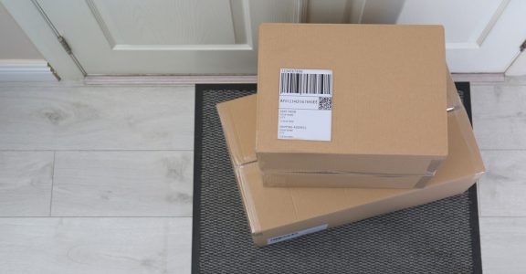 shipping-label-on-box-infront-of-a-door