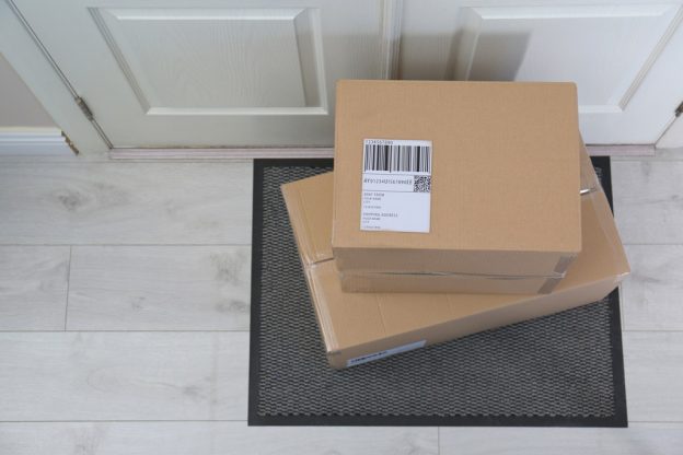 shipping-label-on-box-infront-of-a-door