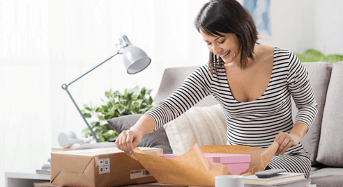 woman packing boxes for delivery