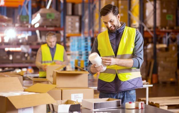 workers-sticking-labels-in-warehouse